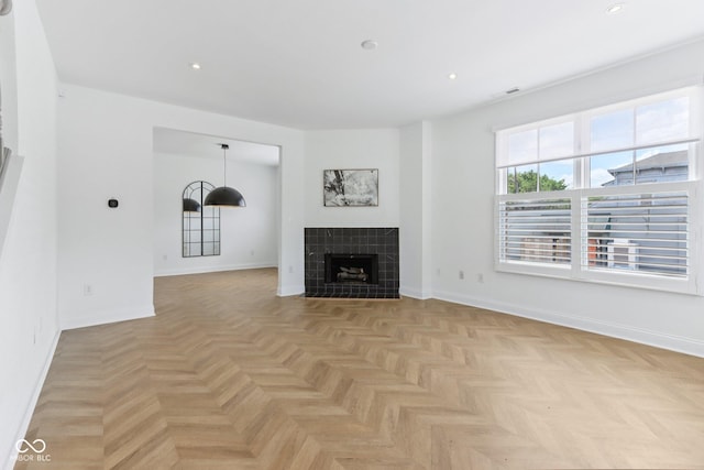 1003 Alabama St, Indianapolis, IN 46202 - unfurnished living room with a tiled fireplace and recessed lighting
