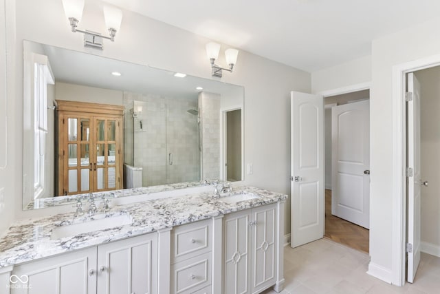 1003 Alabama St, Indianapolis, IN 46202 - full bath featuring a shower stall and double vanity