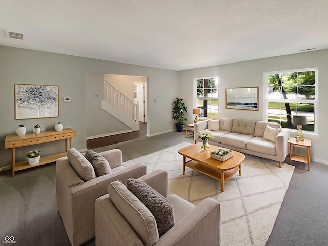 81 Brookland Ln, Pittsboro, IN 46167 - carpeted living area featuring stairs and baseboards