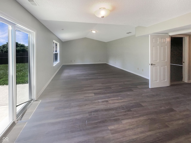 81 Brookland Ln, Pittsboro, IN 46167 - unfurnished room with vaulted ceiling, dark wood-type flooring, and a textured ceiling