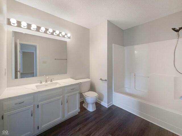 81 Brookland Ln, Pittsboro, IN 46167 - full bathroom with wood finished floors, vanity, a textured ceiling, and shower / bath combination