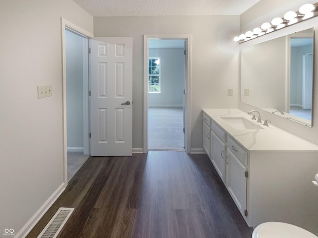 81 Brookland Ln, Pittsboro, IN 46167 - bathroom with vanity, wood finished floors, and a textured ceiling