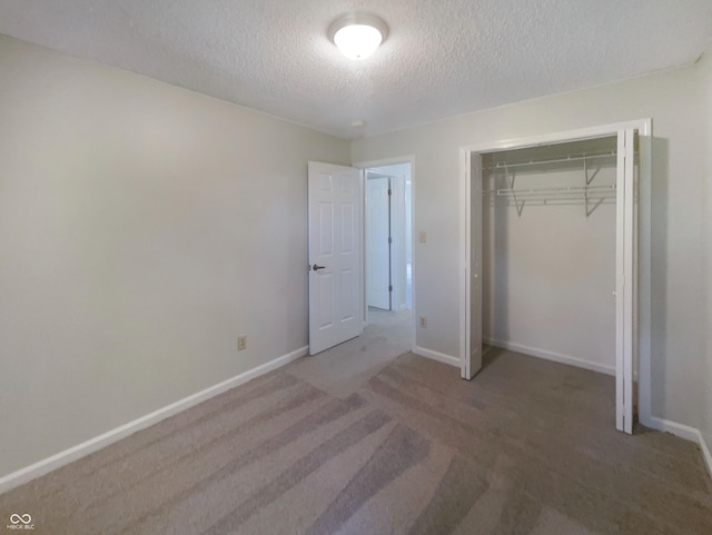 81 Brookland Ln, Pittsboro, IN 46167 - unfurnished bedroom featuring a textured ceiling, carpet flooring, and a closet