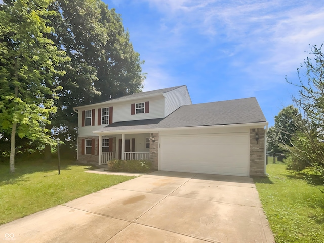 81 Brookland Ln, Pittsboro, IN 46167 - view of front of home with a porch, a garage, a front lawn, concrete driveway, and brick siding