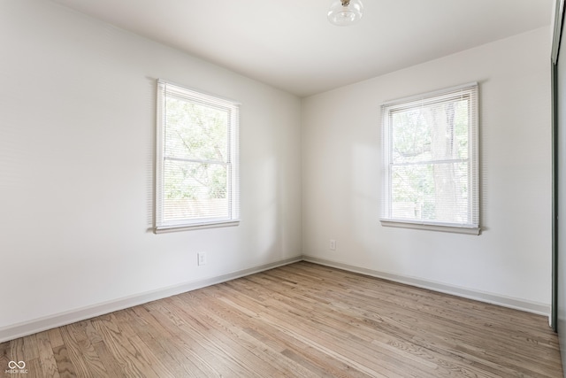 316 Ohmer Ave, Indianapolis, IN 46219 - unfurnished room with healthy amount of natural light and wood finished floors