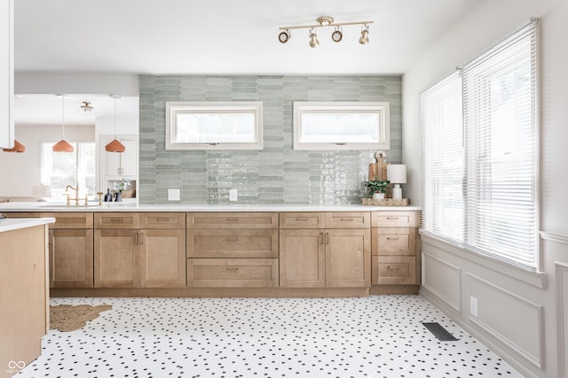 316 Ohmer Ave, Indianapolis, IN 46219 - bar featuring tasteful backsplash and decorative light fixtures