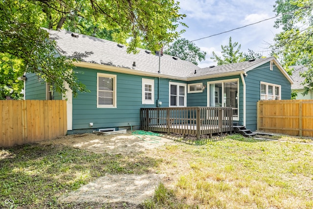316 Ohmer Ave, Indianapolis, IN 46219 - rear view of property featuring a fenced backyard and a wooden deck