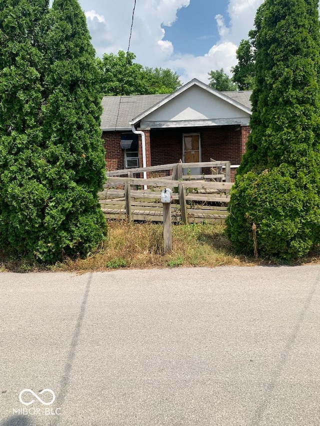 4547 Zoeller Ave, Indianapolis, IN 46226 - bungalow-style home with brick siding and covered porch