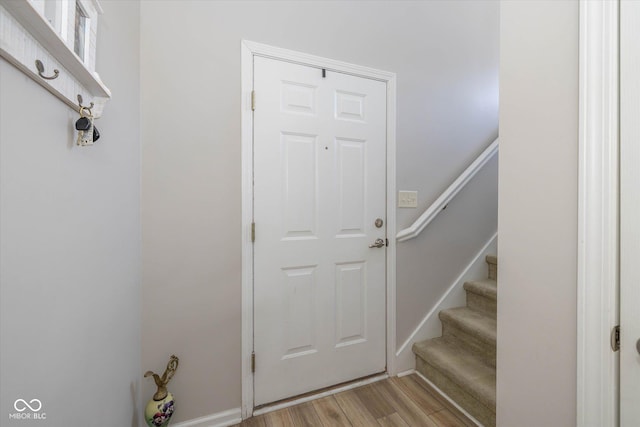 4285 Washington Blvd, Plainfield, IN 46168 - doorway to outside featuring light wood-type flooring and stairway