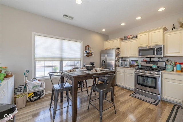 4285 Washington Blvd, Plainfield, IN 46168 - kitchen featuring appliances with stainless steel finishes, light wood finished floors, recessed lighting, and light countertops
