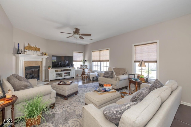 4285 Washington Blvd, Plainfield, IN 46168 - living area featuring a ceiling fan, a tiled fireplace, and wood finished floors