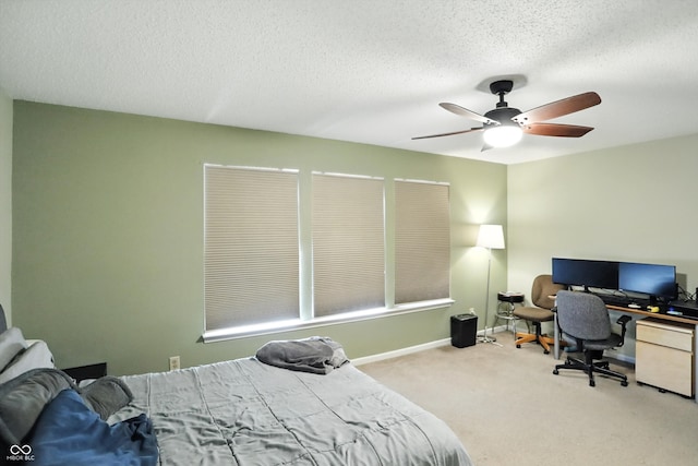 2421 Amberleigh Dr, Plainfield, IN 46168 - carpeted bedroom with a textured ceiling, ceiling fan, and an office area