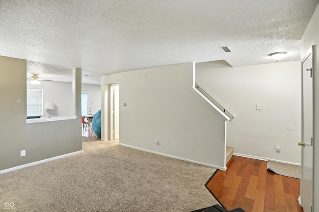 2421 Amberleigh Dr, Plainfield, IN 46168 - spare room with a textured ceiling, ceiling fan, stairway, and wood finished floors