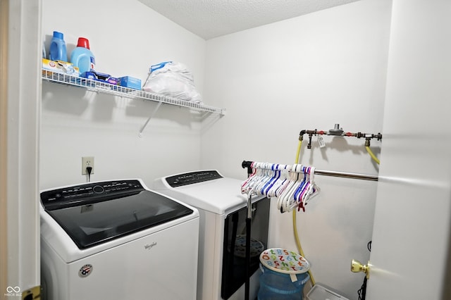 2421 Amberleigh Dr, Plainfield, IN 46168 - laundry room featuring separate washer and dryer and a textured ceiling