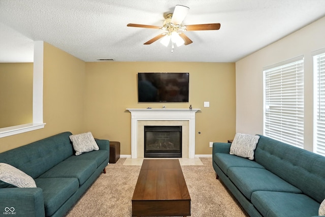 2421 Amberleigh Dr, Plainfield, IN 46168 - living area with carpet, ceiling fan, and a fireplace with flush hearth