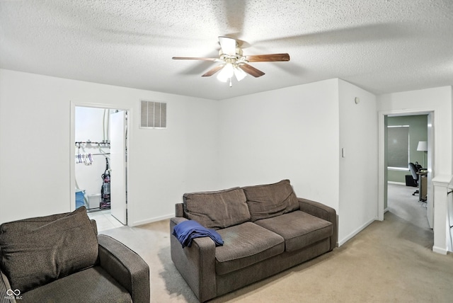 2421 Amberleigh Dr, Plainfield, IN 46168 - living room with ceiling fan, light colored carpet, and a textured ceiling