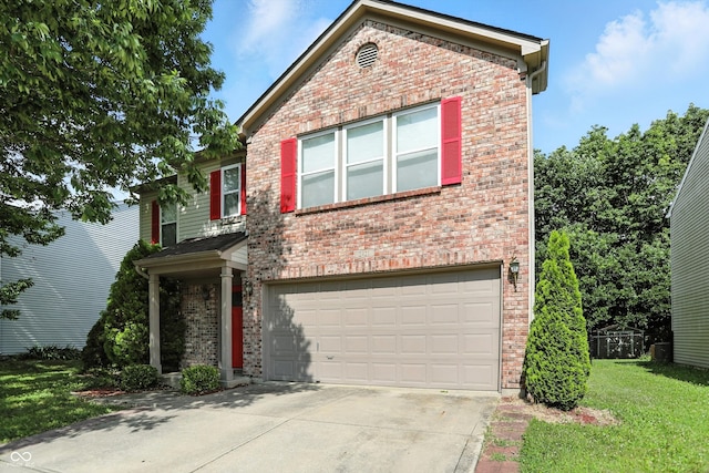 2421 Amberleigh Dr, Plainfield, IN 46168 - traditional home featuring brick siding, driveway, an attached garage, and a front lawn