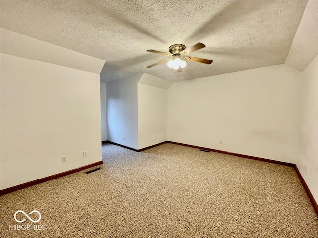 35 Northridge Ct, Brownsburg, IN 46112 - additional living space with ceiling fan, carpet, a textured ceiling, and vaulted ceiling
