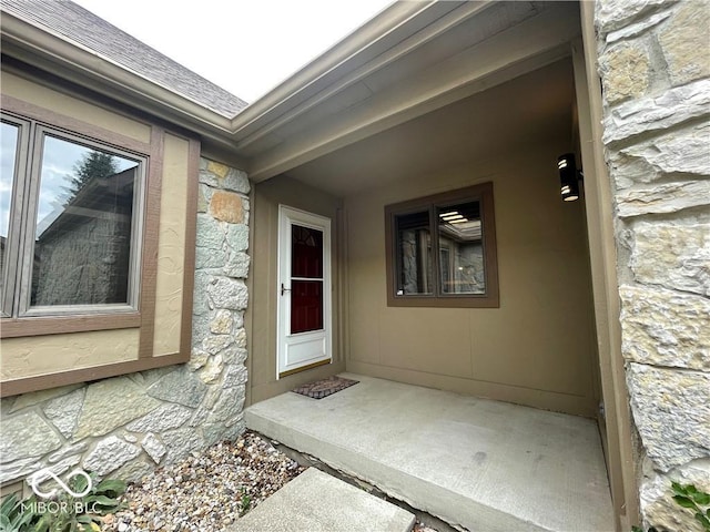 35 Northridge Ct, Brownsburg, IN 46112 - doorway to property featuring stone siding and a shingled roof