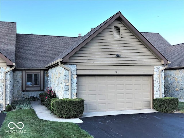 35 Northridge Ct, Brownsburg, IN 46112 - view of side of home featuring stone siding, roof with shingles, a garage, and driveway