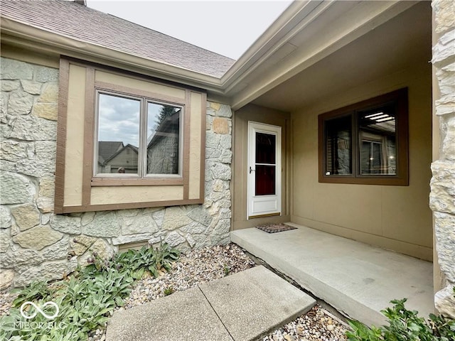 35 Northridge Ct, Brownsburg, IN 46112 - doorway to property featuring stone siding and a shingled roof
