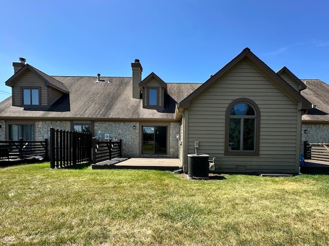 35 Northridge Ct, Brownsburg, IN 46112 - back of property with stone siding, a chimney, and roof with shingles