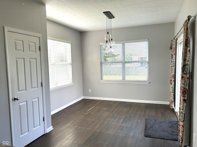 8287 Falkirk Dr, Avon, IN 46123 - unfurnished dining area with dark wood-style floors and a textured ceiling