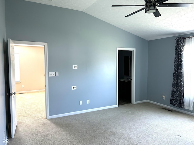 8287 Falkirk Dr, Avon, IN 46123 - unfurnished bedroom featuring vaulted ceiling, carpet floors, a textured ceiling, ensuite bath, and a ceiling fan