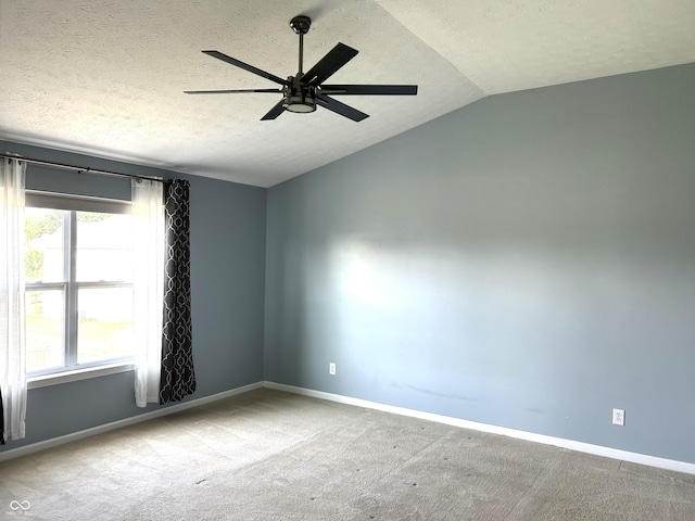8287 Falkirk Dr, Avon, IN 46123 - spare room with vaulted ceiling, a ceiling fan, a textured ceiling, and carpet floors