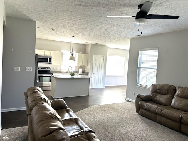 8287 Falkirk Dr, Avon, IN 46123 - living room featuring dark wood finished floors, a ceiling fan, and a textured ceiling