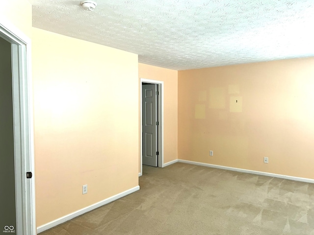 8287 Falkirk Dr, Avon, IN 46123 - spare room with a smoke detector, light carpet, and a textured ceiling