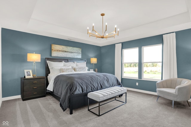 17040 Daly Dr, Noblesville, IN 46062 - bedroom with a chandelier, a tray ceiling, and carpet flooring