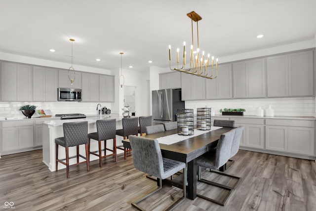 17040 Daly Dr, Noblesville, IN 46062 - dining room featuring light wood-type flooring, recessed lighting, and a chandelier