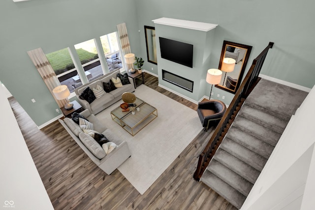 17040 Daly Dr, Noblesville, IN 46062 - living area featuring wood finished floors, stairs, and a high ceiling