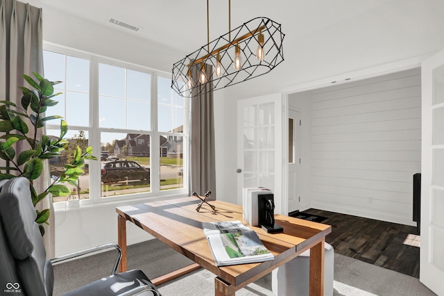 17040 Daly Dr, Noblesville, IN 46062 - dining space with dark wood-style flooring, a chandelier, and french doors