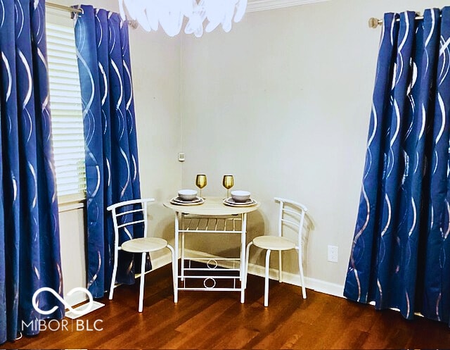 2419 Mars Hill St, Indianapolis, IN 46241 - dining space featuring wood finished floors and crown molding