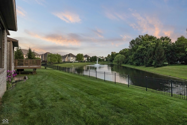 9877 Wading Crane Ave, Fishers, IN 46055 - yard at dusk with a water view