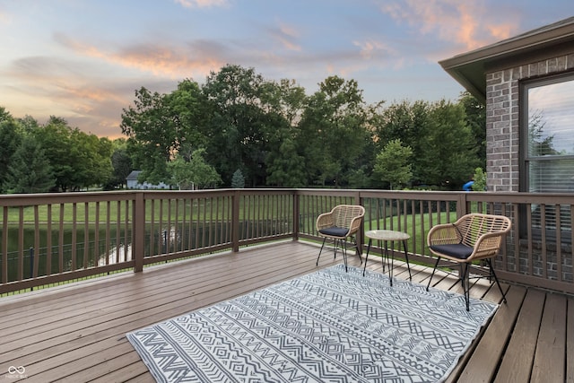 9877 Wading Crane Ave, Fishers, IN 46055 - deck at dusk with view of wooded area and a yard