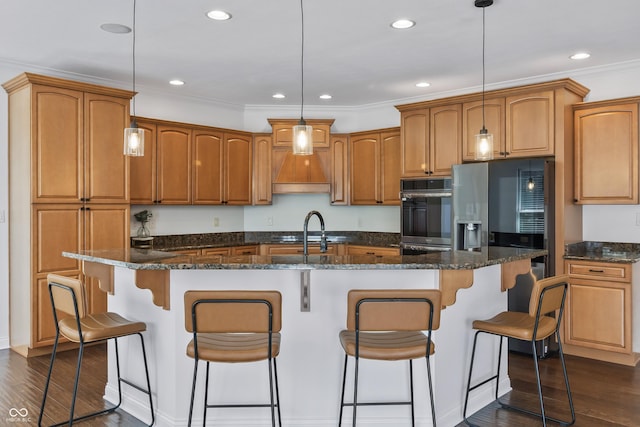 9877 Wading Crane Ave, Fishers, IN 46055 - kitchen with dark wood-style floors, appliances with stainless steel finishes, hanging light fixtures, brown cabinets, and recessed lighting