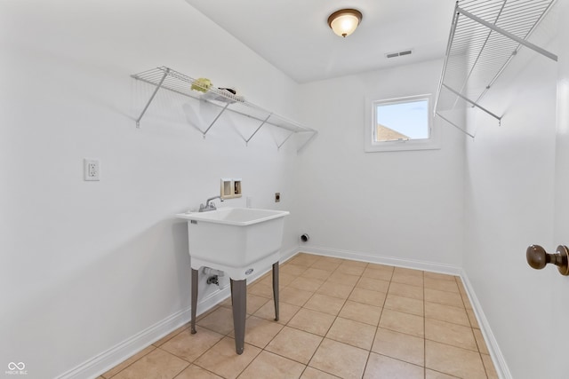 9877 Wading Crane Ave, Fishers, IN 46055 - laundry room with washer hookup, electric dryer hookup, and light tile patterned floors