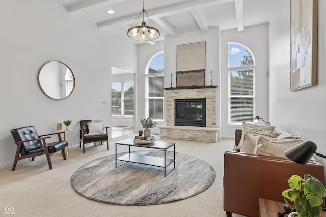 9877 Wading Crane Ave, Fishers, IN 46055 - carpeted living room featuring a fireplace, beamed ceiling, and a chandelier