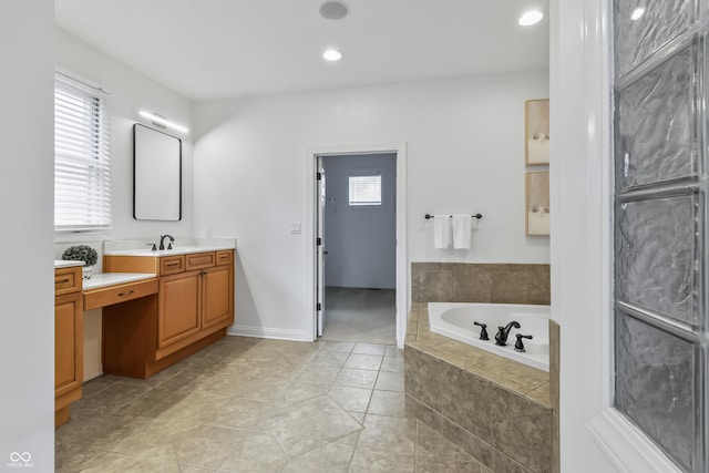 9877 Wading Crane Ave, Fishers, IN 46055 - bathroom featuring vanity, a garden tub, tile patterned flooring, and recessed lighting