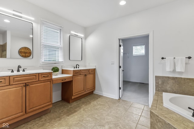 9877 Wading Crane Ave, Fishers, IN 46055 - bathroom with two vanities, a bath, recessed lighting, and tile patterned floors