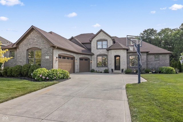 9877 Wading Crane Ave, Fishers, IN 46055 - french country style house featuring an attached garage, brick siding, roof with shingles, and a front yard