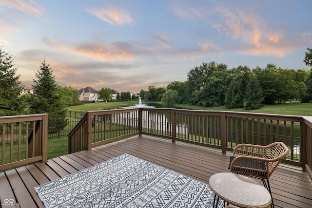 9877 Wading Crane Ave, Fishers, IN 46055 - deck at dusk with a water view and a fenced backyard