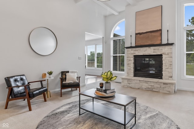 9877 Wading Crane Ave, Fishers, IN 46055 - carpeted living room with beam ceiling and a fireplace