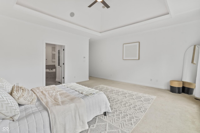 9877 Wading Crane Ave, Fishers, IN 46055 - bedroom with a tray ceiling, carpet flooring, connected bathroom, and ceiling fan