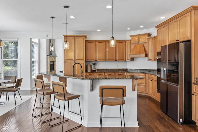 9877 Wading Crane Ave, Fishers, IN 46055 - kitchen with stainless steel fridge with ice dispenser, custom range hood, dark wood-type flooring, a breakfast bar area, and recessed lighting