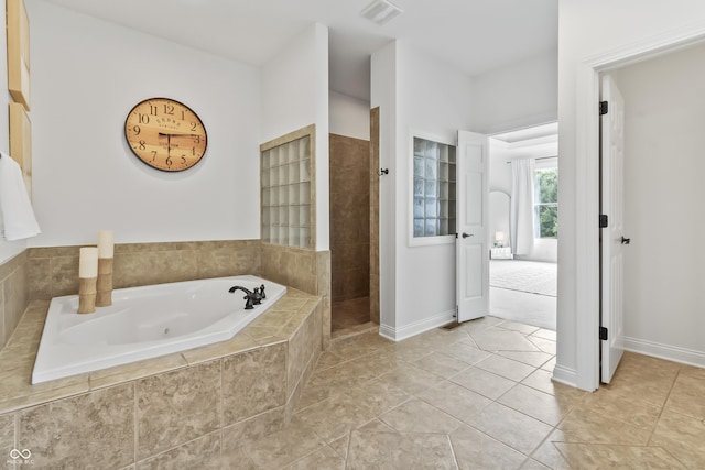 9877 Wading Crane Ave, Fishers, IN 46055 - full bathroom featuring a jetted tub, walk in shower, and tile patterned flooring