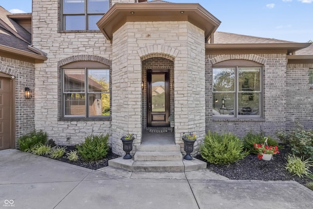 9877 Wading Crane Ave, Fishers, IN 46055 - property entrance with roof with shingles and brick siding